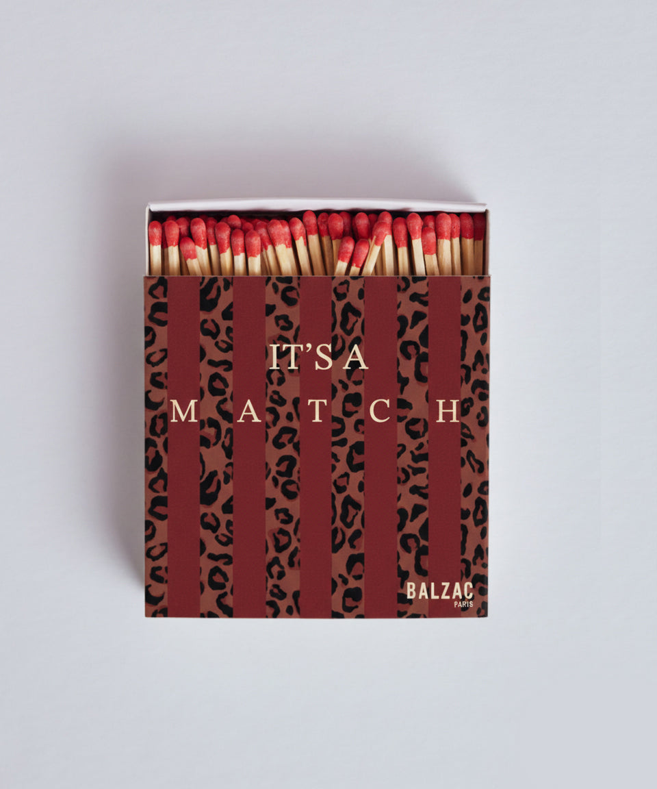 Red and leopard striped matchbox
