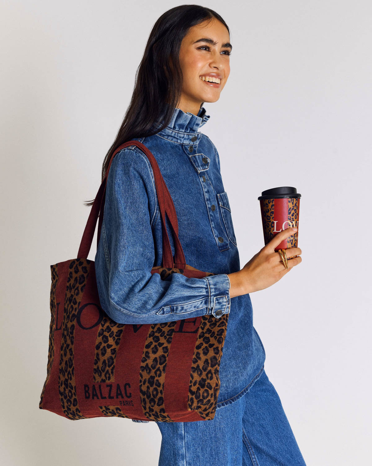 Travel mug with red and leopard stripes