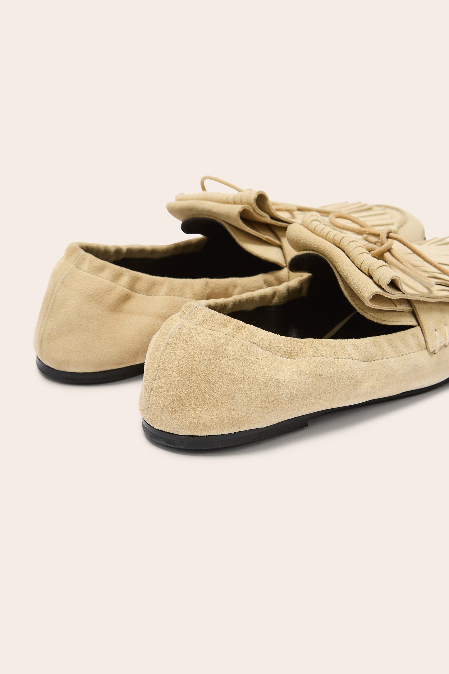 Alix fringed loafers in sand-colored split leather