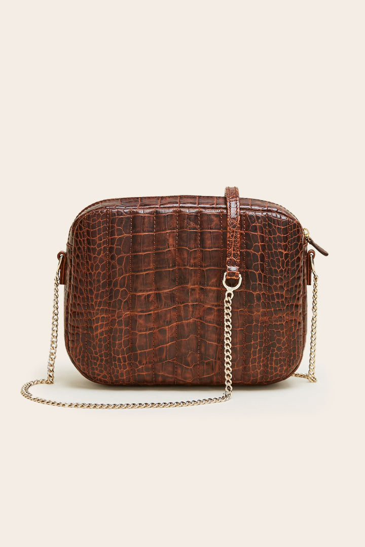 Embossed cognac caesar bag