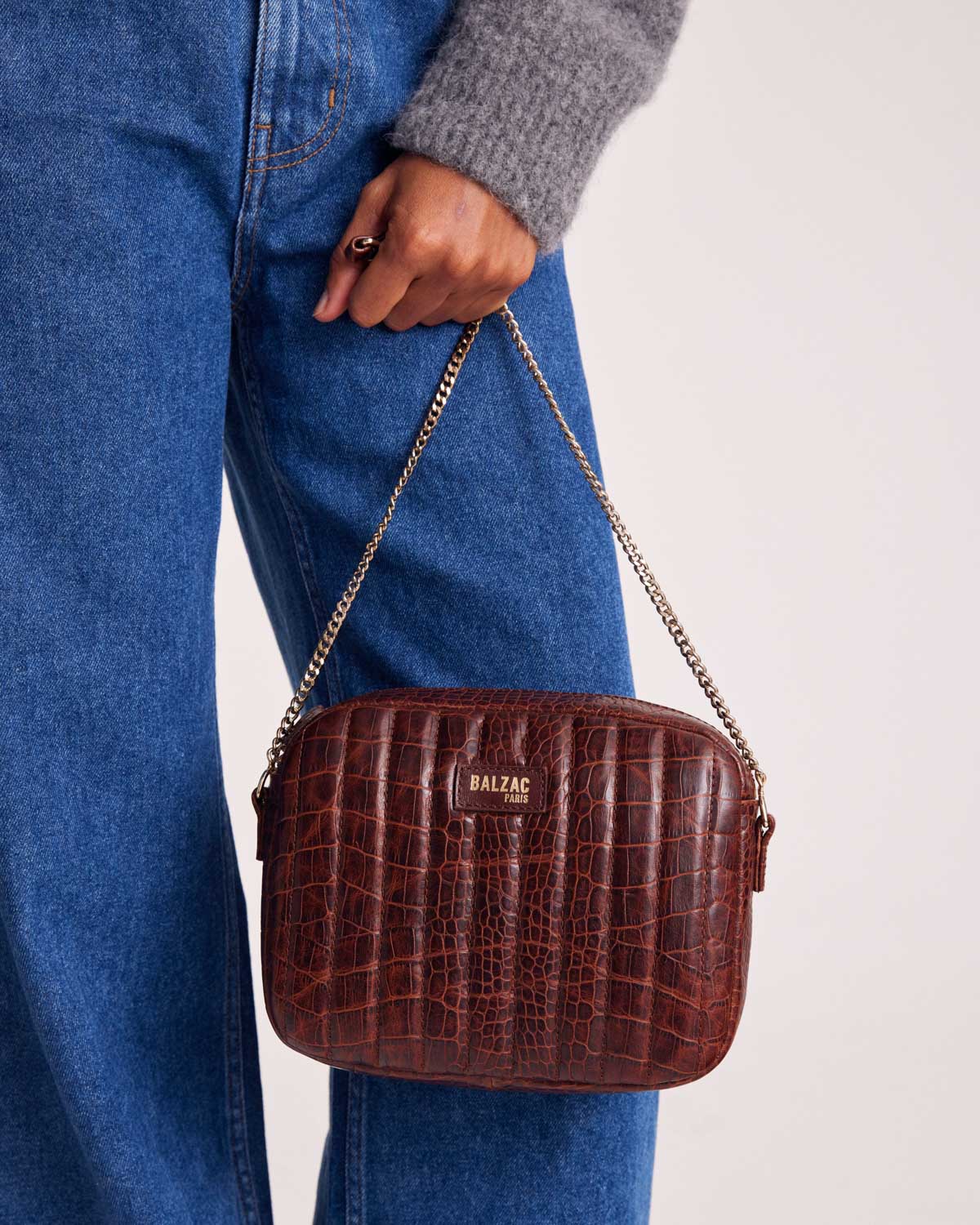 Embossed cognac caesar bag