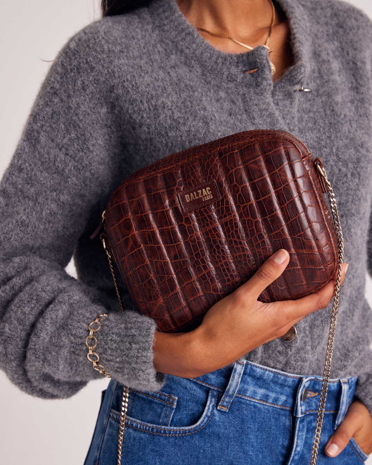 Embossed cognac caesar bag