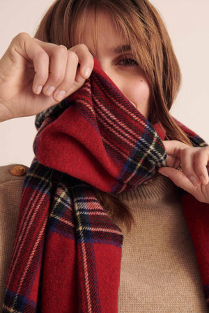 Public red tartan scarf