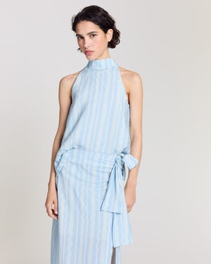 Arielle top with wave stripes on a blue background