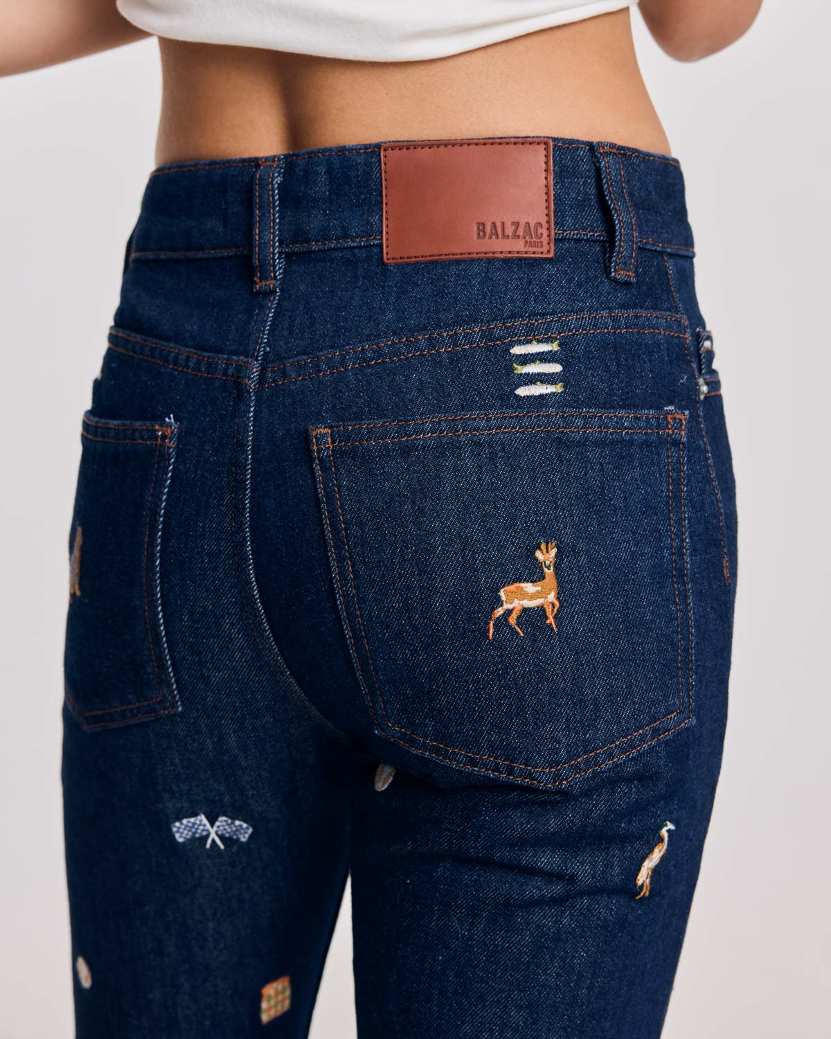 Blue raw denim jeans and ivy embroidery