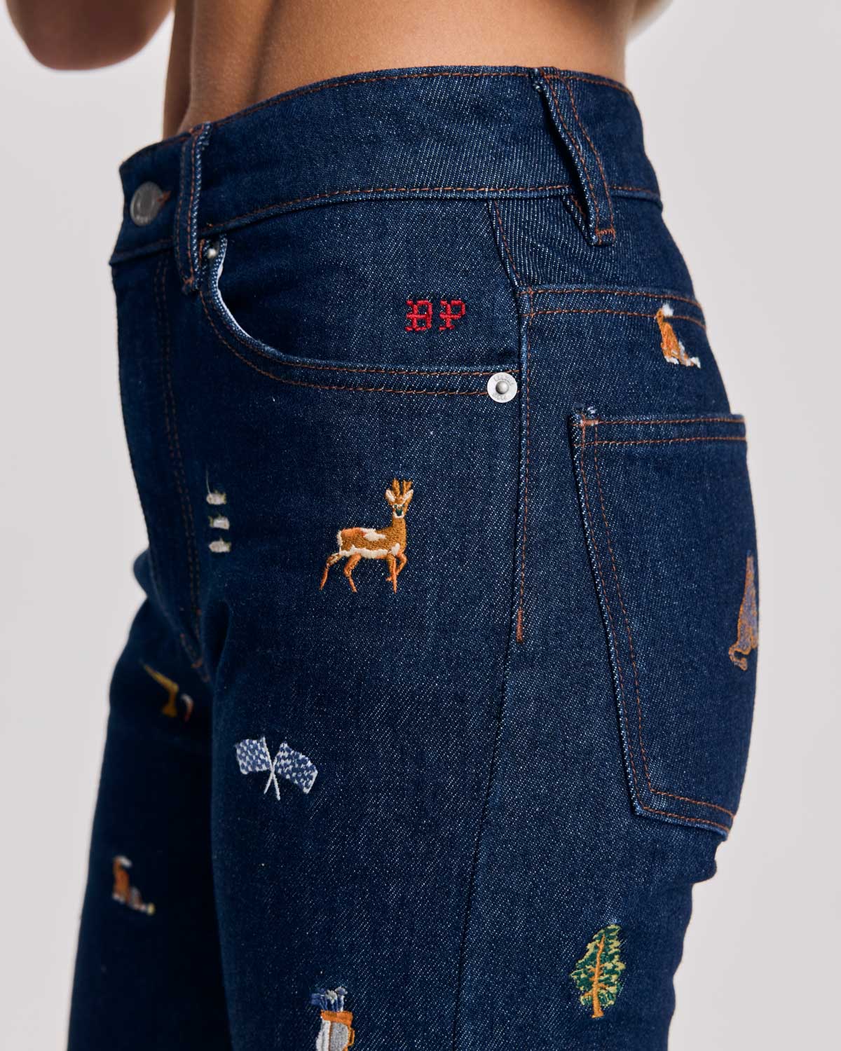 Blue raw denim jeans and ivy embroidery