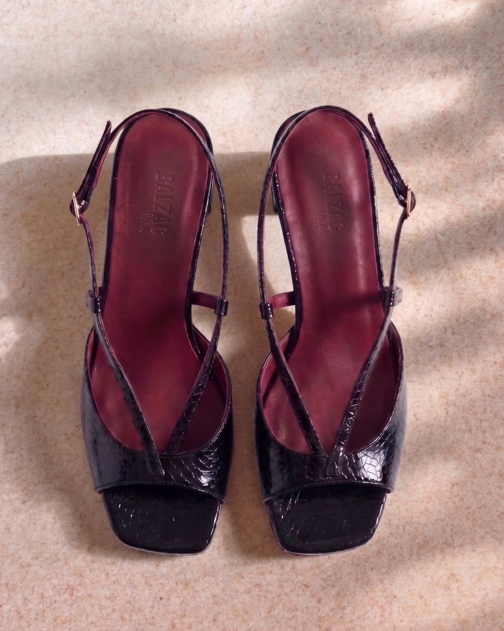 Black embossed patent leather Tella sandals
