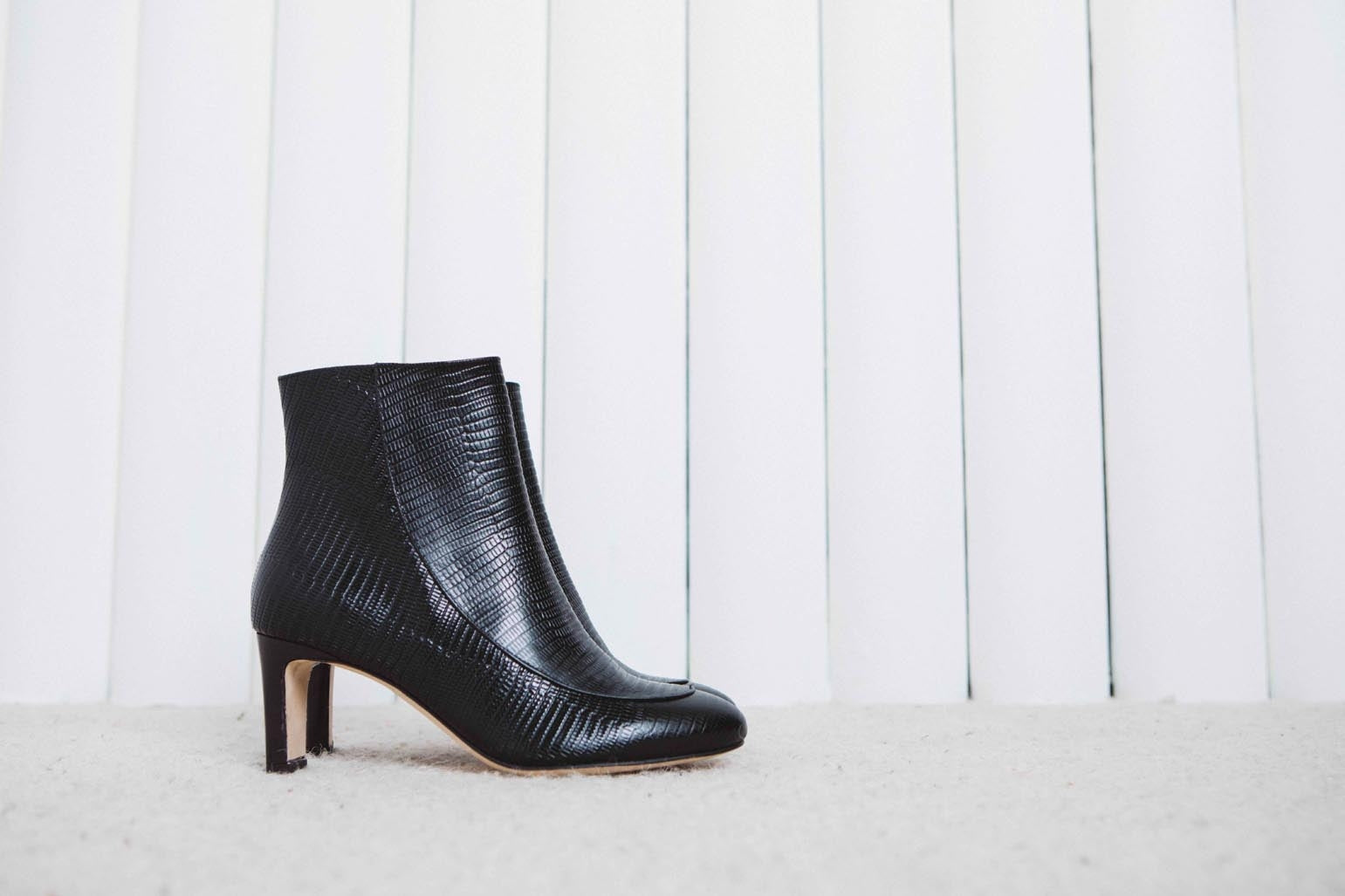 Swann black ankle boots with reptile embossing